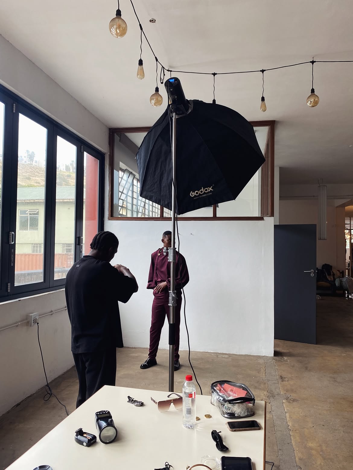 Study VII: Behind the lens — Godox strobe, model on set, and stylist workstation