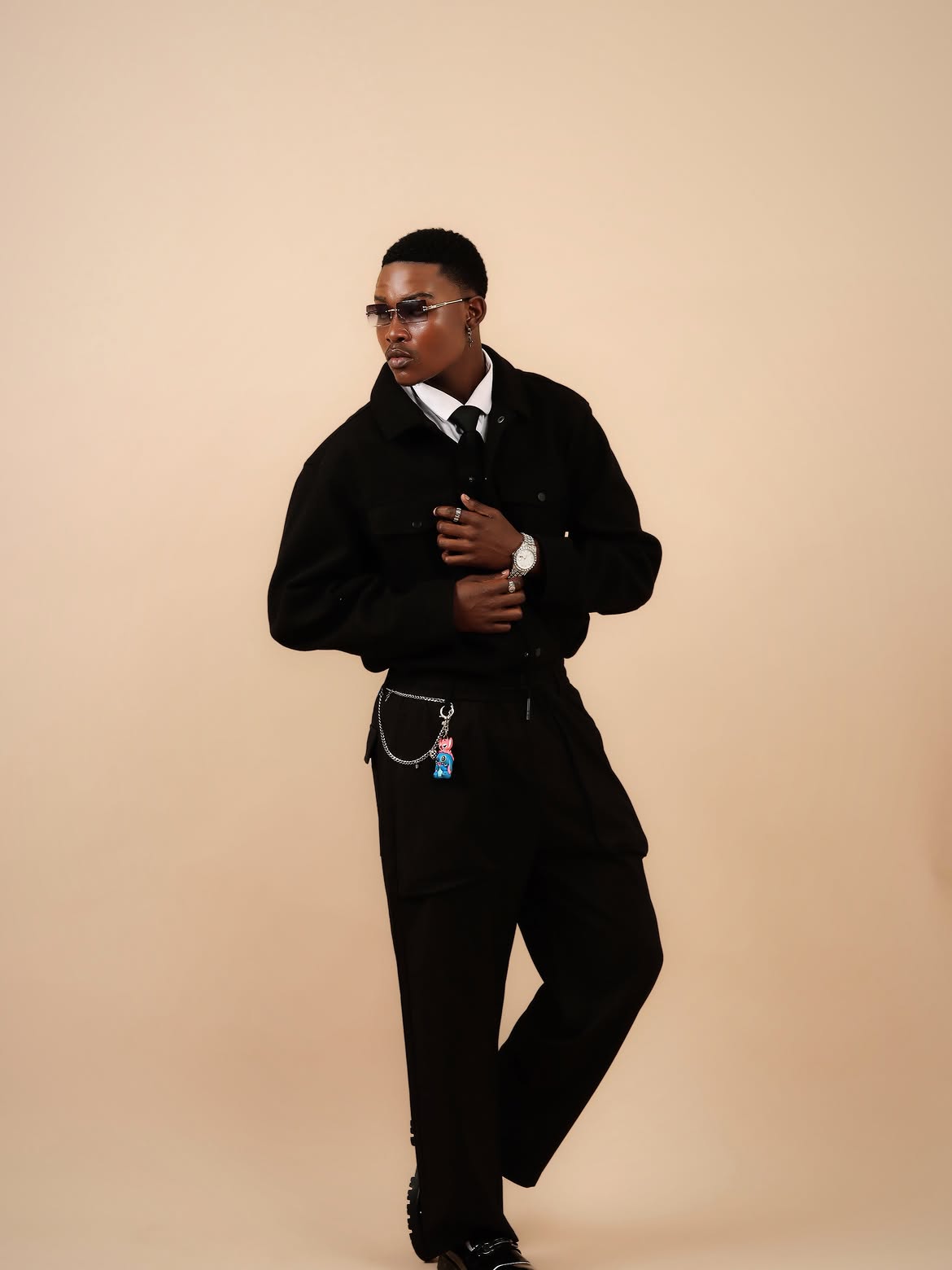 Study IV: The stance — lapel grip, silver trouser chain and diamond watch